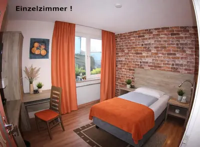 Ein Bett oder Betten in einem Zimmer der Unterkunft B&B Landhotel Römerkessel