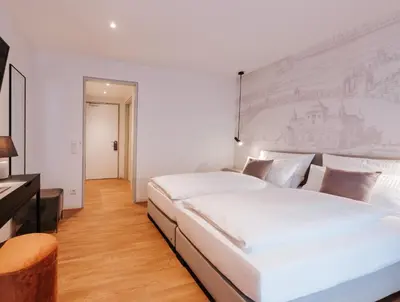 Ein Bett oder Betten in einem Zimmer der Unterkunft HAIMHAUSERS Hotel Garni