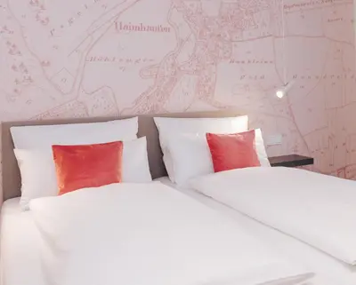 Ein Bett oder Betten in einem Zimmer der Unterkunft HAIMHAUSERS Hotel Garni