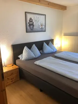Ein Bett oder Betten in einem Zimmer der Unterkunft Ferienhaus Veronika mit 2000qm Garten und Bergblick