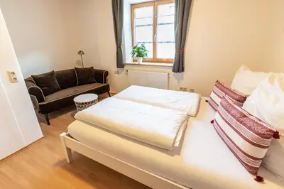 Ein Bett oder Betten in einem Zimmer der Unterkunft Ammergau Lodge