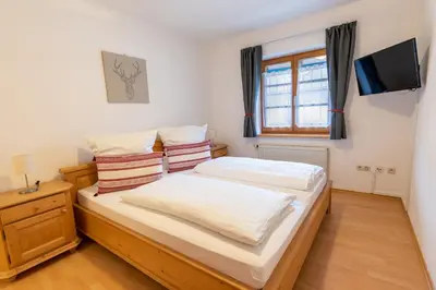 Ein Bett oder Betten in einem Zimmer der Unterkunft Ammergau Lodge