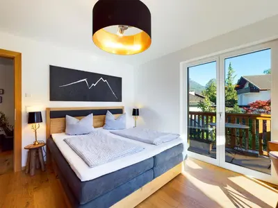 Ein Bett oder Betten in einem Zimmer der Unterkunft Garmisch-Classix