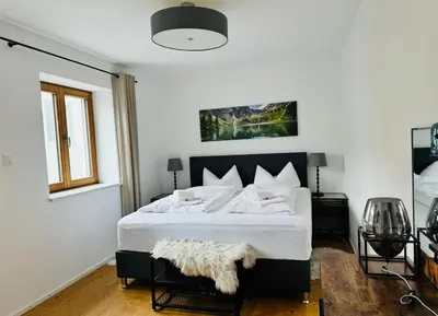 Ein Bett oder Betten in einem Zimmer der Unterkunft Apartment Schliersee - Stylisch, zentral, familienfreundlich