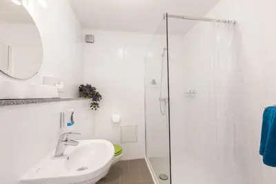 Ein Badezimmer in der Unterkunft Hotel Ludwig
