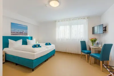 Ein Bett oder Betten in einem Zimmer der Unterkunft Hotel Ludwig
