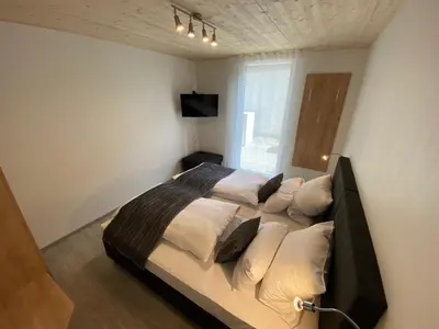 Ein Bett oder Betten in einem Zimmer der Unterkunft Ferienwohnung Preisinger