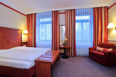 Ein Bett oder Betten in einem Zimmer der Unterkunft Hotel Concorde