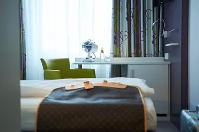 Ein Bett oder Betten in einem Zimmer der Unterkunft Hotel Concorde