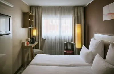 Ein Bett oder Betten in einem Zimmer der Unterkunft Leonardo Boutique Hotel Munich