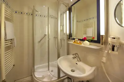 Ein Badezimmer in der Unterkunft Hotel Torbräu