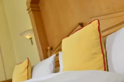 Ein Bett oder Betten in einem Zimmer der Unterkunft Hotel Torbräu