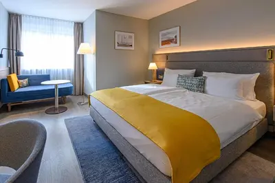Ein Bett oder Betten in einem Zimmer der Unterkunft Hotel Europa