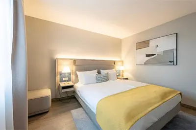 Ein Bett oder Betten in einem Zimmer der Unterkunft Hotel Europa