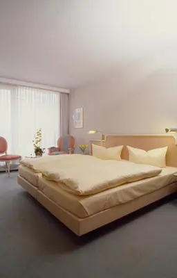 Ein Bett oder Betten in einem Zimmer der Unterkunft Hotel Ambiente Garni