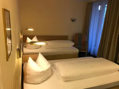 Ein Bett oder Betten in einem Zimmer der Unterkunft Hotel Ambiente Garni