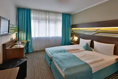 Ein Bett oder Betten in einem Zimmer der Unterkunft Hotel Wallis