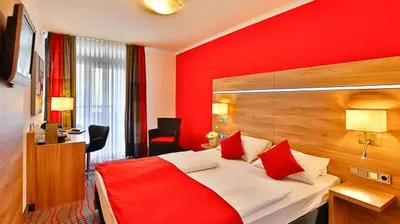 Ein Bett oder Betten in einem Zimmer der Unterkunft Hotel Wallis