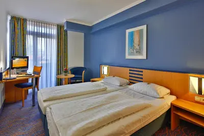 Ein Bett oder Betten in einem Zimmer der Unterkunft Hotel Wallis