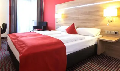 Ein Bett oder Betten in einem Zimmer der Unterkunft Hotel Wallis
