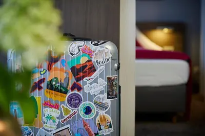 Ein Bett oder Betten in einem Zimmer der Unterkunft Hotel Mirabell by Maier Privathotels