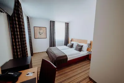 Ein Bett oder Betten in einem Zimmer der Unterkunft Hotel Ars Vivendi München