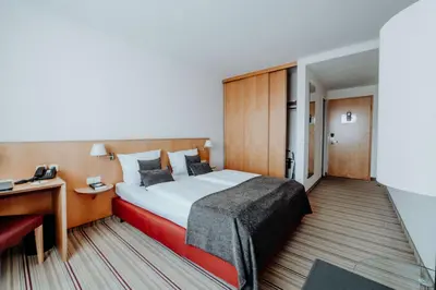 Ein Bett oder Betten in einem Zimmer der Unterkunft Hotel Ars Vivendi München