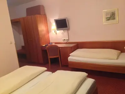 Ein Bett oder Betten in einem Zimmer der Unterkunft Hotel Carmen