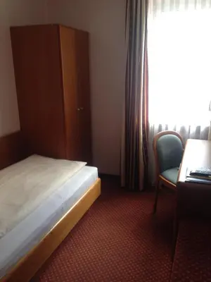 Ein Bett oder Betten in einem Zimmer der Unterkunft Hotel Carmen