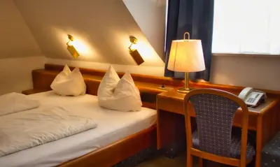 Ein Bett oder Betten in einem Zimmer der Unterkunft Hotel Carmen