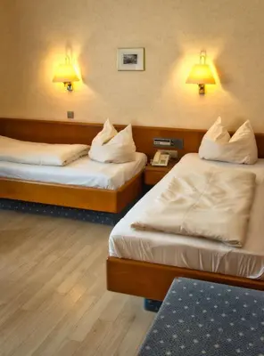 Ein Bett oder Betten in einem Zimmer der Unterkunft Hotel Carmen
