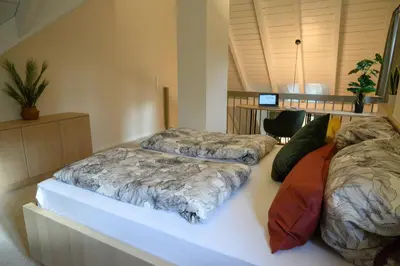 Ein Bett oder Betten in einem Zimmer der Unterkunft InselMühle