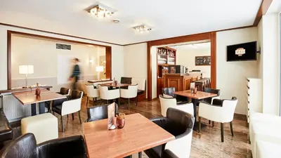 Ein Sitzbereich in der Unterkunft Hotel Imperial