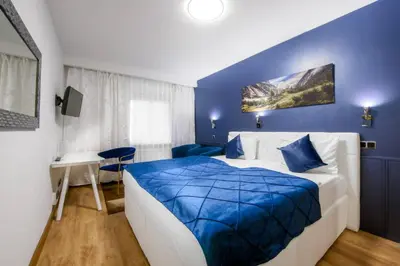 Ein Bett oder Betten in einem Zimmer der Unterkunft Hotel Rivoli Charme