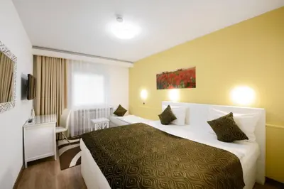 Ein Bett oder Betten in einem Zimmer der Unterkunft Hotel Rivoli Charme
