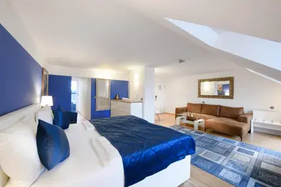 Ein Bett oder Betten in einem Zimmer der Unterkunft Hotel Rivoli Charme