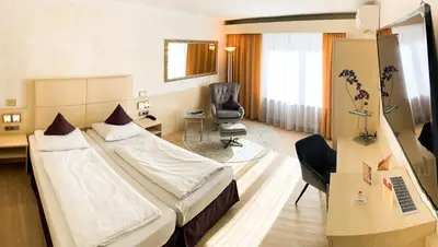 Ein Bett oder Betten in einem Zimmer der Unterkunft City Hotel Ost am Kö