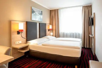 Ein Bett oder Betten in einem Zimmer der Unterkunft Europäischer Hof