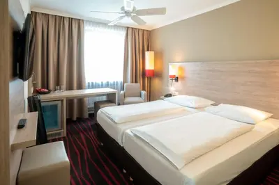 Ein Bett oder Betten in einem Zimmer der Unterkunft Europäischer Hof