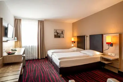 Ein Bett oder Betten in einem Zimmer der Unterkunft Europäischer Hof