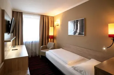 Ein Bett oder Betten in einem Zimmer der Unterkunft Europäischer Hof