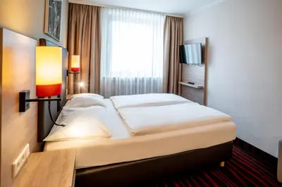 Ein Bett oder Betten in einem Zimmer der Unterkunft Europäischer Hof
