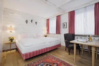 Ein Bett oder Betten in einem Zimmer der Unterkunft Eden Hotel Wolff