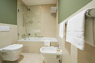 Ein Badezimmer in der Unterkunft Eden Hotel Wolff