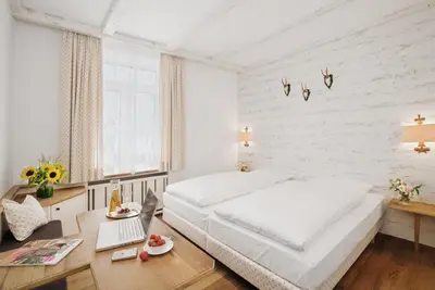 Ein Bett oder Betten in einem Zimmer der Unterkunft Eden Hotel Wolff