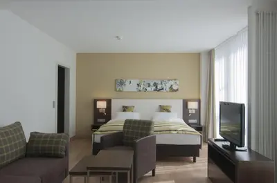 Ein Bett oder Betten in einem Zimmer der Unterkunft Holiday Inn Munich Unterhaching by IHG
