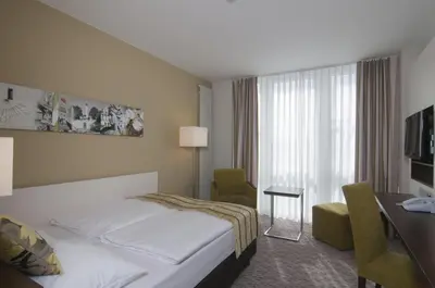 Ein Bett oder Betten in einem Zimmer der Unterkunft Holiday Inn Munich Unterhaching by IHG
