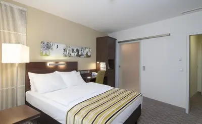 Ein Bett oder Betten in einem Zimmer der Unterkunft Holiday Inn Munich Unterhaching by IHG
