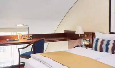 Ein Bett oder Betten in einem Zimmer der Unterkunft Living Hotel Prinzessin Elisabeth