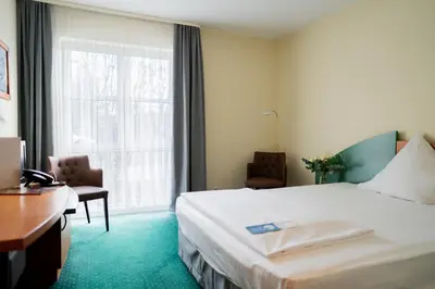 Ein Bett oder Betten in einem Zimmer der Unterkunft Trip Inn Hotel Dasing-Augsburg
